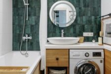 02 a bright and cool bathroom with a green skinny tile wall, a tub, a timber vanity with a built-in washine machine