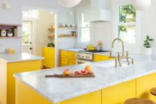 06 a bright kitchen done with yellow cabinets, white stone countertops and all white everything for a chic and bold look