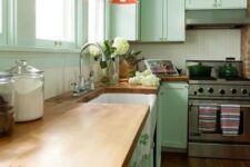 a cute kitchen with wooden countertops