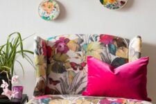 15 a bold floral loveseat, a gallery wlal with floral embroidery are cool and bright additions to a living room
