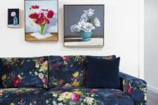 16 a bold living room with a navy floral sofa, a hot pink rug and a mini gallery wall with floral artwork