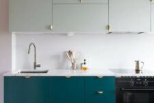 20 a teal and mint modern kitchen with a white backsplash and copper touches looks bold and chic