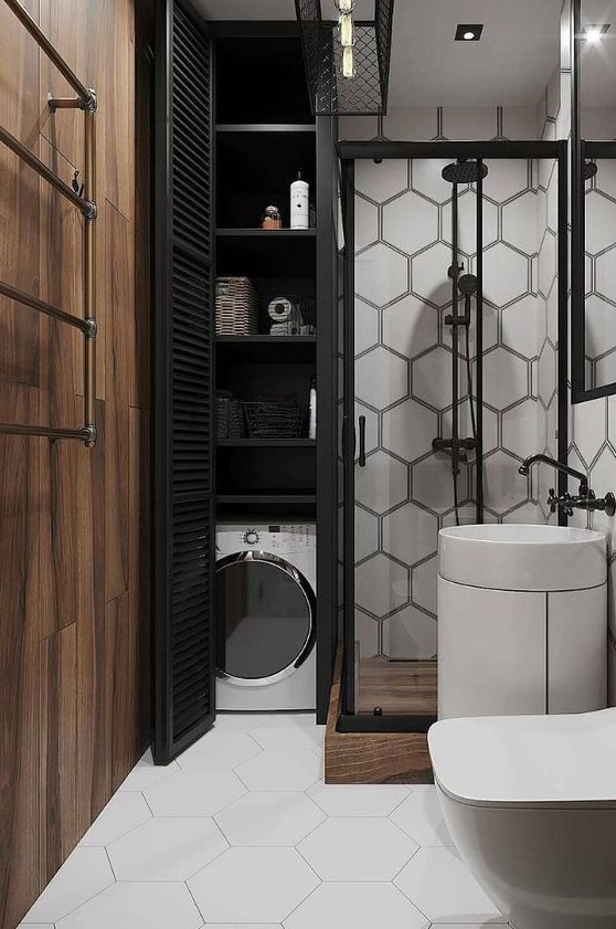 a modern monochromatic bathroom with a hidden wahsing machine and storage space next to the shower
