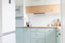 25 an airy Scandinavian kitchen with stained and mint blue cabinets, a white tile backsplash and a geometric floor plus a mint pendant lamp