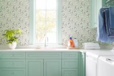 45 a mint green farmhouse laundry with shaker cabinets, white countertops, printed wallpaper, a green and white checked floor