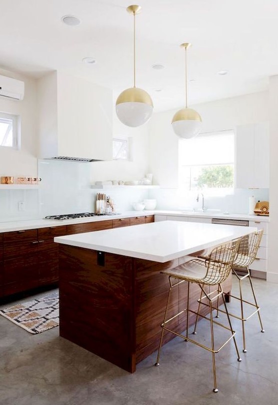 Dark stained wood and white cabinets plus metallic touches for a mid century modern space