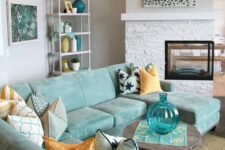 51 a neutral living room spruced up with a gorgeous mint blue sectional sofa and accessories for a seaside feel