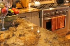 a neutral kitchen with granite coutnertops