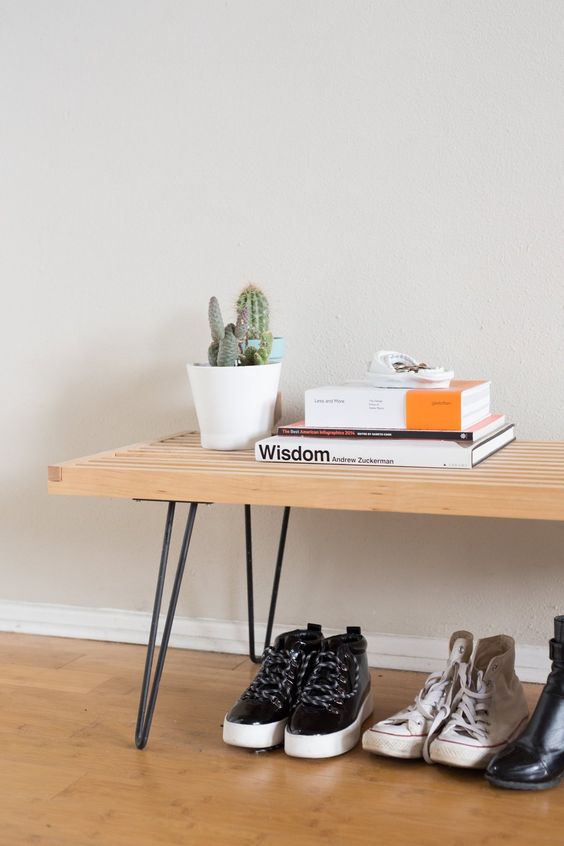 A stylish bench with black hairpin legs is a cool idea for a mid century modern or boho space, it looks cool