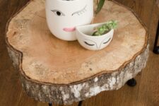 08 a lovely side table of a tree slice and black hairpin legs is a cool rustic piece that you can make yourself
