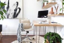 10 a beautiful biophilic home office with a hairpin leg desk, shelves with potted plants and decor, a white chair, an artwork and some plants