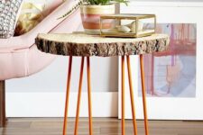 14 a side table of a tree slice and orange hairpin legs is a cool decor piece for a living room in mid-century modern style