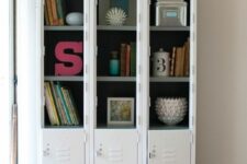 23 a set of white lockers turned into a bookcase with books and art on display is a cool idea for a modern space