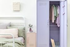 24 a pastel bedroom with a white metal bed, pastel bedding, a blush locker nightstand and a lilac locker as a wardrobe is a lovely space