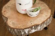 26 a lovely side table of a tree slice and black hairpin legs is a cool rustic piece that you can make yourself