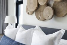 26 a tree slice wall art makes a statement instead of a large statement headboard and it looks gorgeous