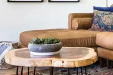 27 a lovely tree slice hairpin leg coffee table with a laminated surface is a stylish addition to a mid-century modern living room