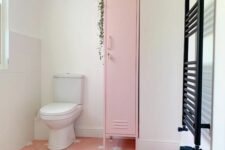 30 a cool bathroom with a pink star print floor, a pink skinny locker for storing stuff, a black radiator is a lovely space