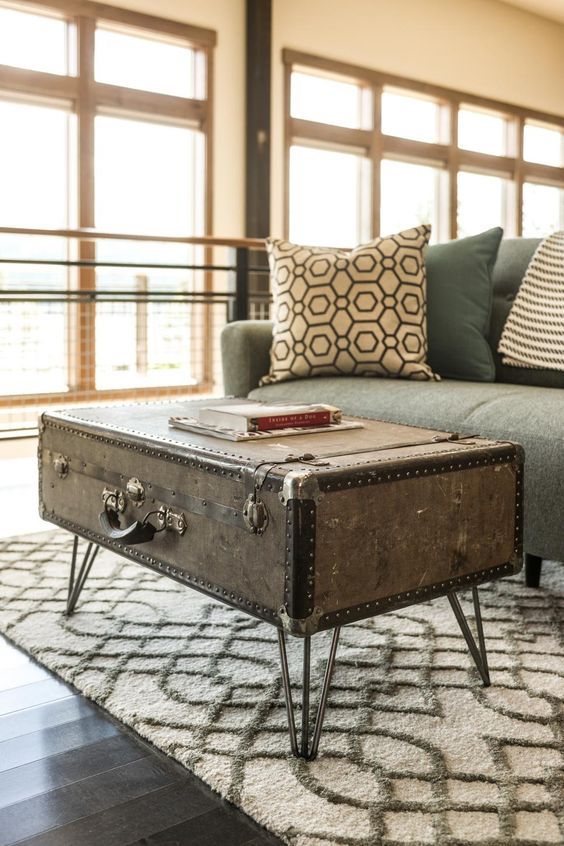 a vintage suitcase placed on hairpin legs can become a beautiful and catchy coffee or side table with its own story