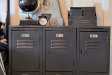52 black lockers as an alternative to a usual dresser or nightstand are a cool idea for an industrial kid’s room