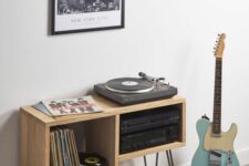 55 a stylish asymmetrical music console with black hairpin legs is a cool and stylish idea if you love music and vinyl