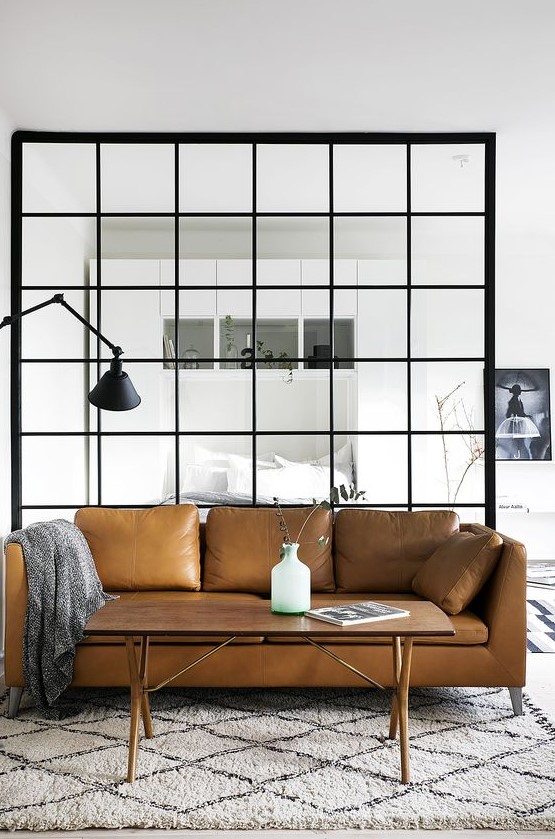 a brown leather Stockholm sofa by IKEA is a stylish statement for a modern living room