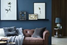 A stylish living room with a navy wall