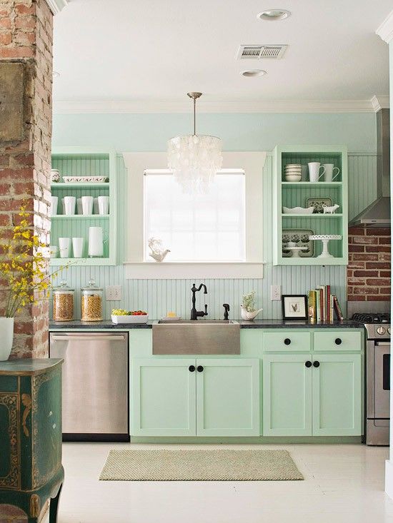 a mint farmhouse kitchen with shaker and open cabinets, a blue beadboard wall, black fixtures and black knobs