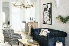 a refined space with shabby touches and a navy velvet Chesterfield sofa as a dark touch