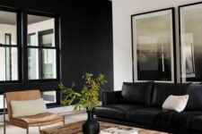 a stylish modern living room with a black leather sofa, a catchy timber coffee table, an amber chair, a printed rug