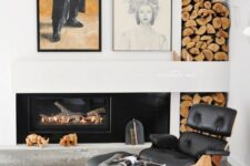 an elegant fireplace nook with a built-in fireplace, a black Eames lounger and an ottoman, a rug, a firewood storage niche