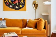 an exquisite living room with a honey yellow sofa, floating shelves for cats, round woodne tables and a bold artwork
