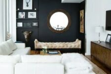 05 a chic modern space with a black wall, creamy furniture, walls and a ceiling and cool accessories and details