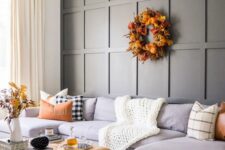 a lovely living room decorated for fall