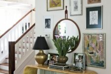 44 a whimsical entryway with a curved console table, a faux fur stool, a bright gallery wall with a mirror and some decor on the table