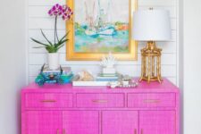 45 a jaw-dropping hot pink grasscloth paper sideboard with gold legs and bright decor will make a statement with color and texture