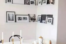 50 a corner gallery wall with black and white artworks in black frames adds personality to the space and makes it cozier