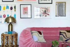 58 a cool and bright living room with pink seating furniture, a coffee table, a rattan side table and a colorful gallery wall