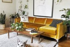 67 a bold mustard velvet sofa is the centerpiece of the living room, with its color and material