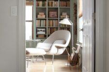 a cozy home library with a comfy chair
