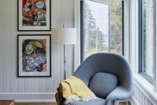 a cool nook by the window with bold artwork and a grey Wumb chair with a bold blanket is cool
