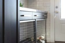 a smart mudroom with a dog crate