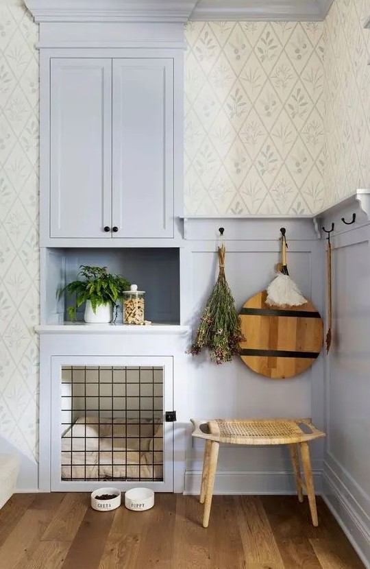 A lilac nook with paneling, a built in cabinet, a built in dog crate with a soft cushion is a lovely idea for a rustic space