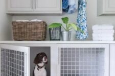 a practical laundry room with a dog crate