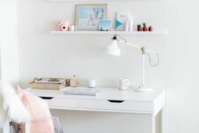 a small serene working space with an IKEA desk, a ghost chair, a couple of ledges and a printed rug is a cool nook