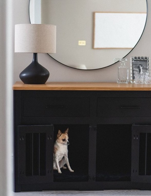 A stylish black console table with built in dog crates is a lovely idea for a modern high end interior