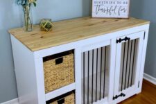 a white farmhouse cabinet with a built-in crate and baskets for storage, a butcherblock countertop and some decor