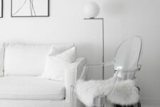 a white living room with a white sofa