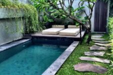05 a gorgeous small backyard with a plunge pool, a living tree and some loungers, grass and stone tiles is welcoming and refreshing