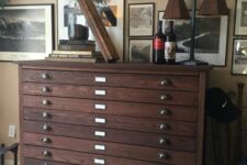 09 a dark-stained filing cabinet with vintage knobs is a stylish vintage and industrial piece of furniture to rock in your space
